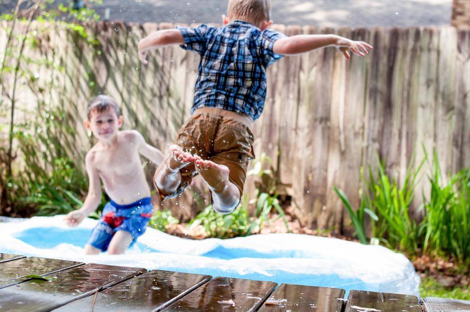 children playing in paddling pool